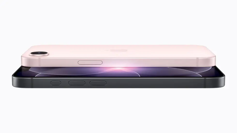 A hand holding a slim modern smartphone against a clean light background, showing the camera module and side profile